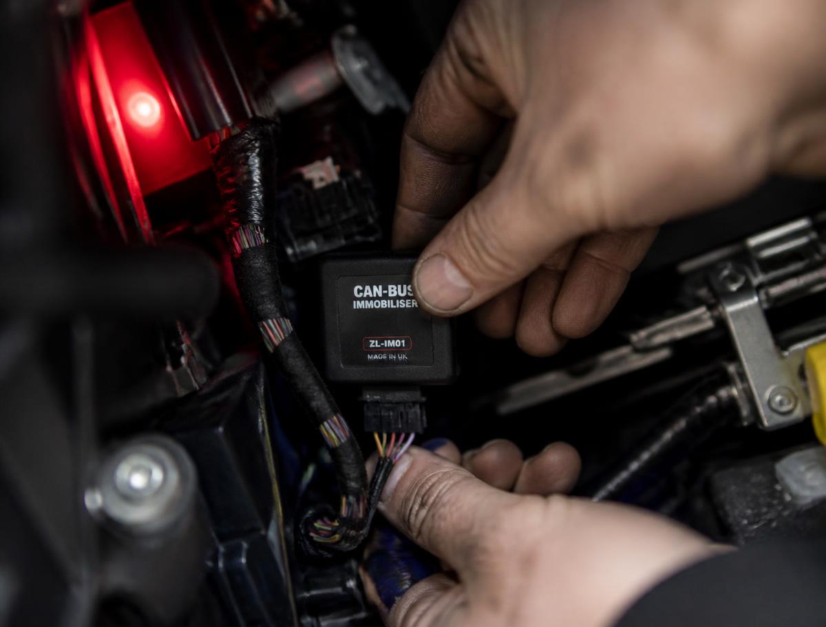 An immobiliser being installed into a vehicle